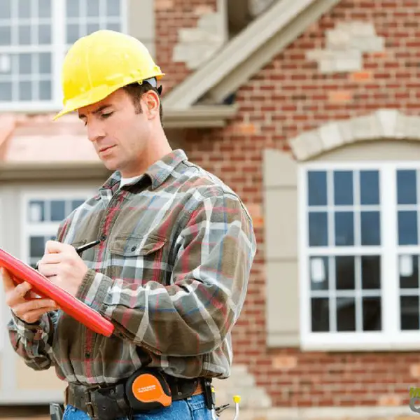 a professional inspecting exterior