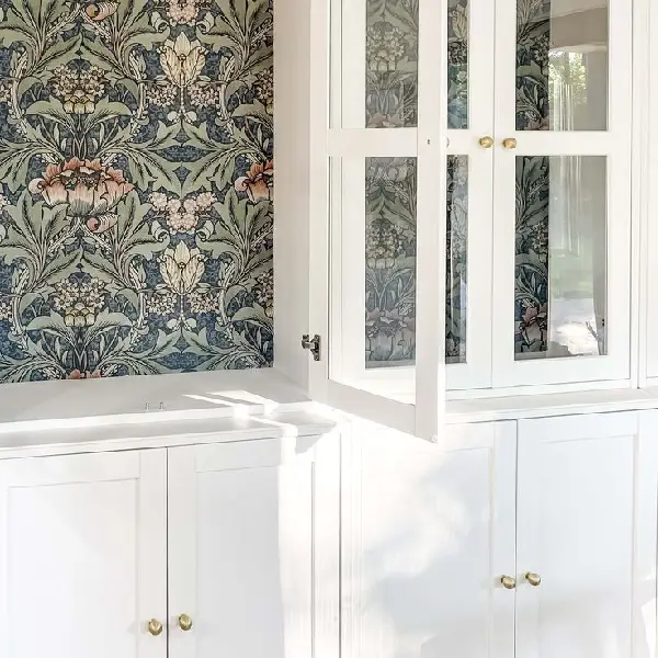 white cabinets with wallpaper