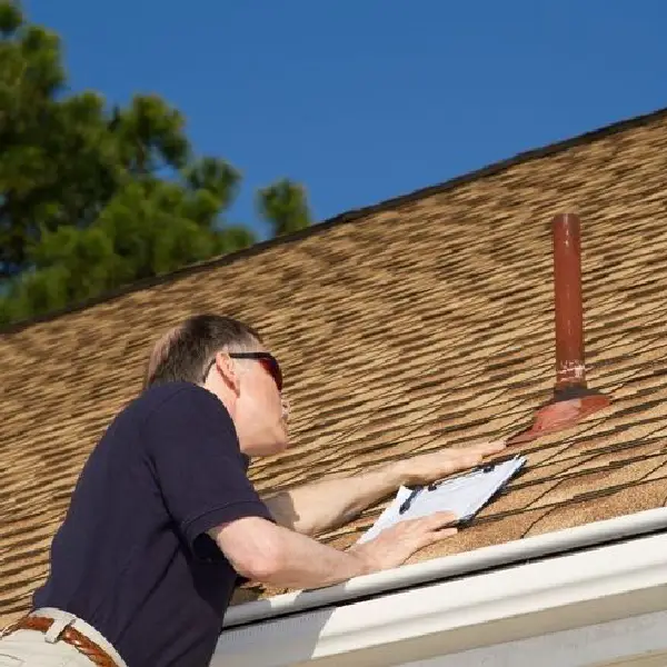 a man doing a home roof inspection